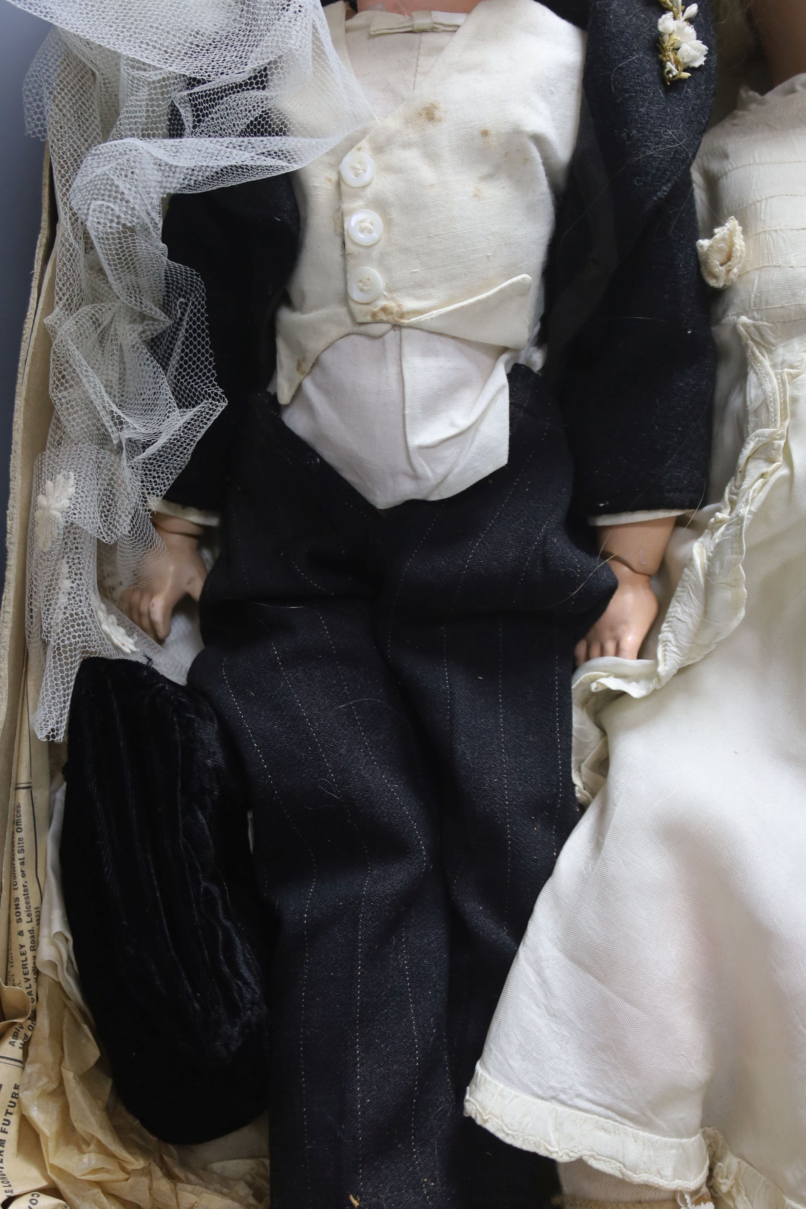 A pair of Armand Marseille 390 bisque head groom and bride dolls, tallest 50cm